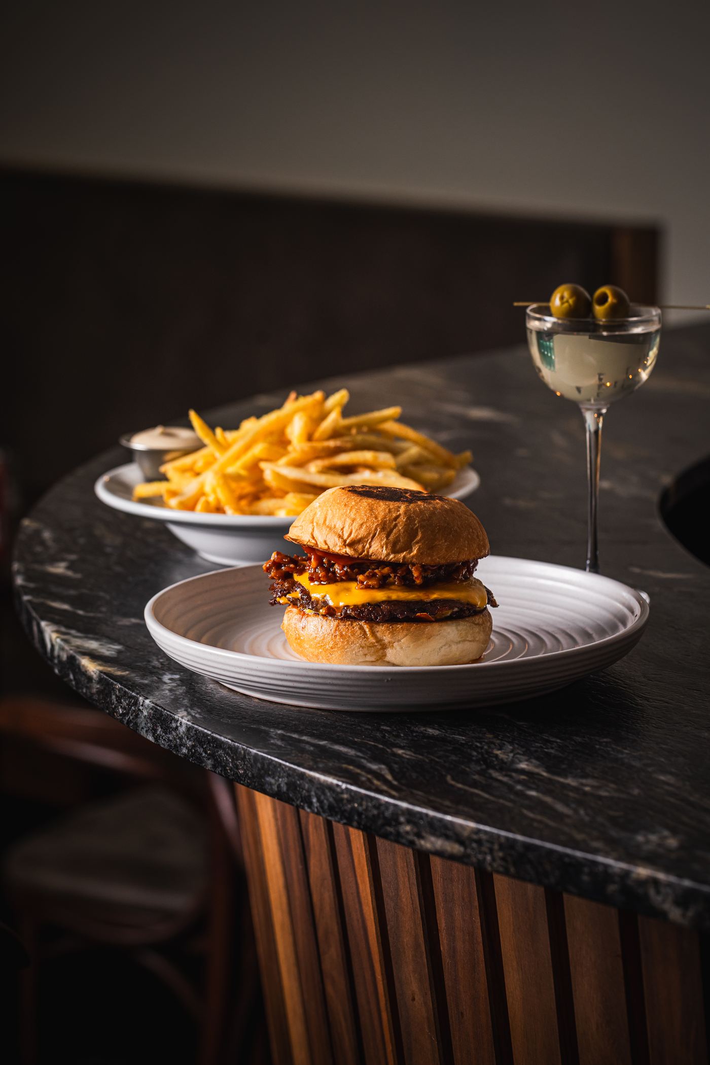 Inside Bar Victoria on Victoria Street, Darlinghurst — burger and martini at the bar