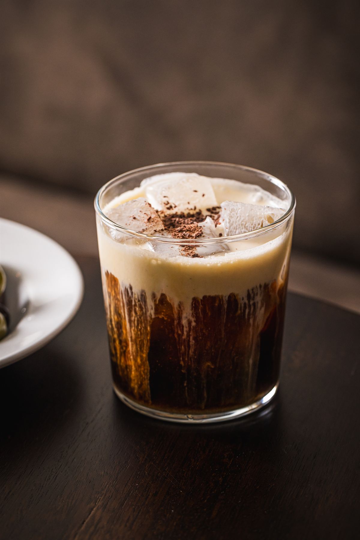 Zorba — dark coffee cocktail over ice, dusted with chocolate